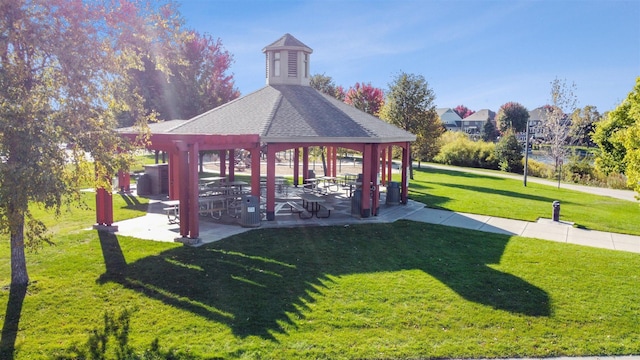 surrounding community with a yard and a gazebo