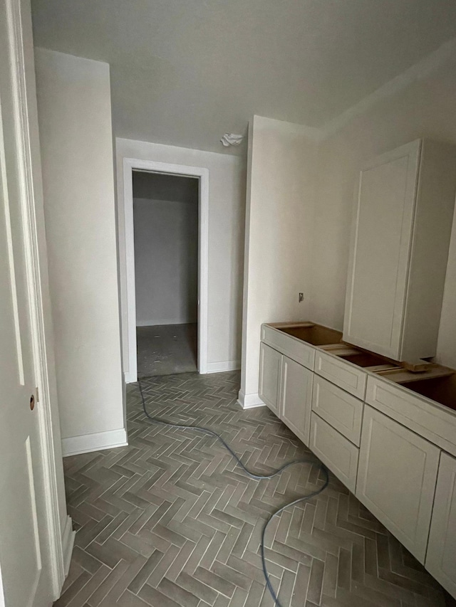 bathroom featuring parquet flooring