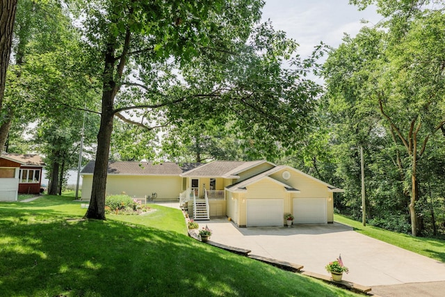 view of front of house featuring a front yard and a garage