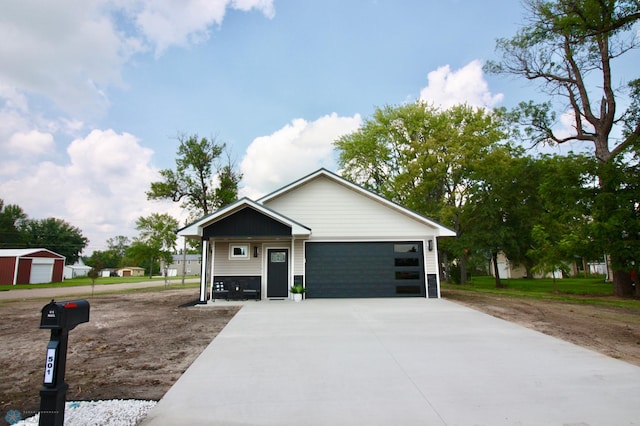 view of front facade with a garage and concrete driveway