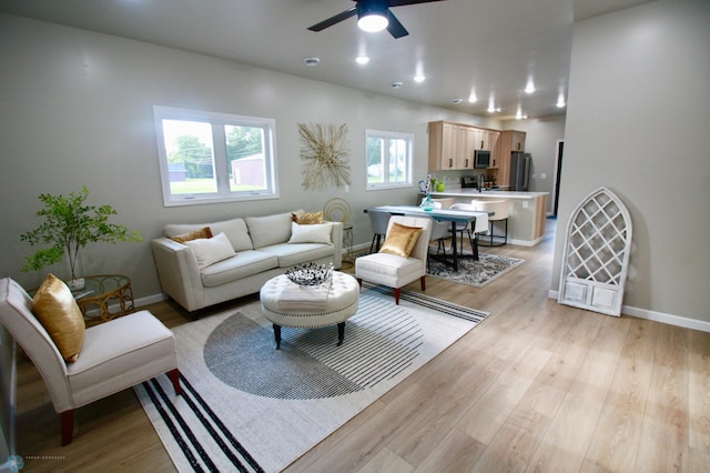 501 1st St NE, Hankinson, ND 58041 - living area featuring recessed lighting, light wood finished floors, a ceiling fan, and baseboards