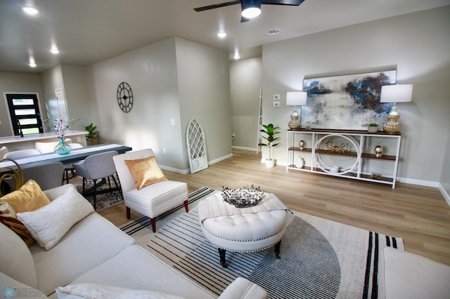 501 1st St NE, Hankinson, ND 58041 - living area featuring baseboards, a ceiling fan, and wood finished floors