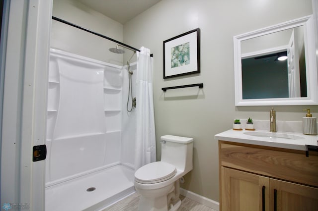 501 1st St NE, Hankinson, ND 58041 - full bathroom featuring baseboards, toilet, vanity, and a stall shower