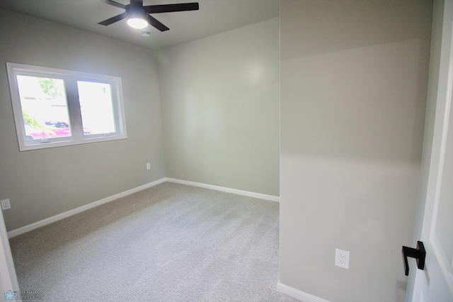 501 1st St NE, Hankinson, ND 58041 - unfurnished room with a ceiling fan, baseboards, and light colored carpet