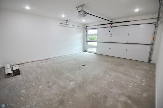 501 1st St NE, Hankinson, ND 58041 - garage featuring a garage door opener and recessed lighting