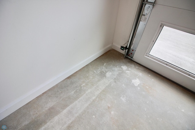 501 1st St NE, Hankinson, ND 58041 - interior details featuring unfinished concrete flooring and baseboards