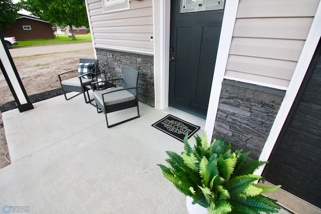 501 1st St NE, Hankinson, ND 58041 - view of exterior entry featuring stone siding