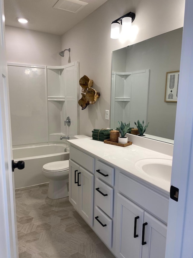 full bathroom with toilet, vanity, and shower / bath combination