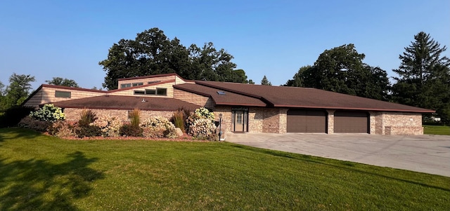 exterior space featuring a garage and a front yard