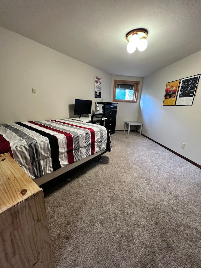 carpeted bedroom featuring a textured ceiling