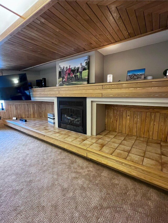 unfurnished living room with carpet and wooden ceiling