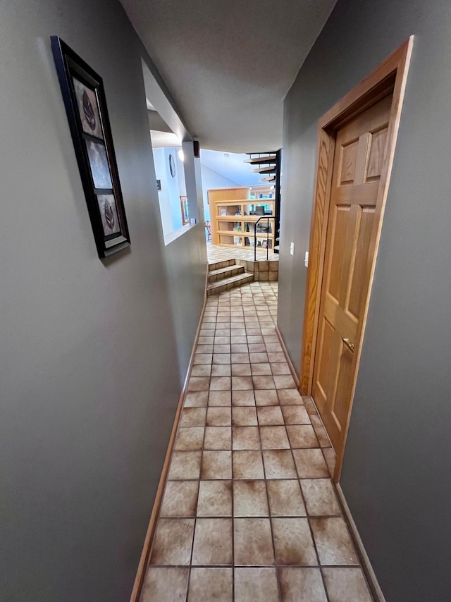 hallway featuring light tile patterned floors