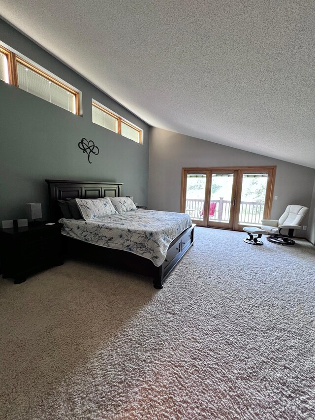 bedroom featuring carpet, a textured ceiling, french doors, and lofted ceiling