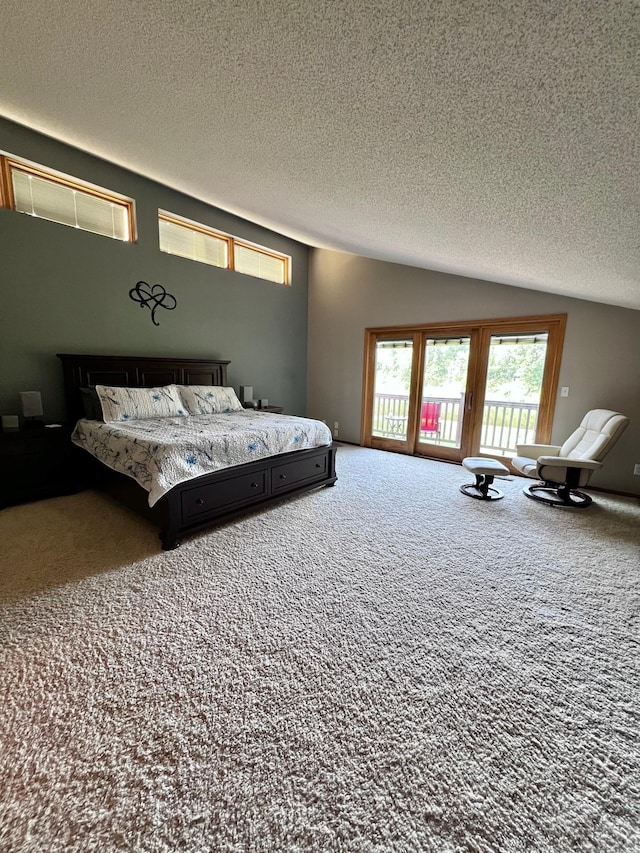 carpeted bedroom with vaulted ceiling, access to exterior, and a textured ceiling