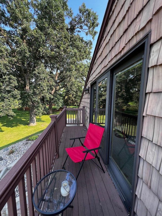 wooden terrace with a yard