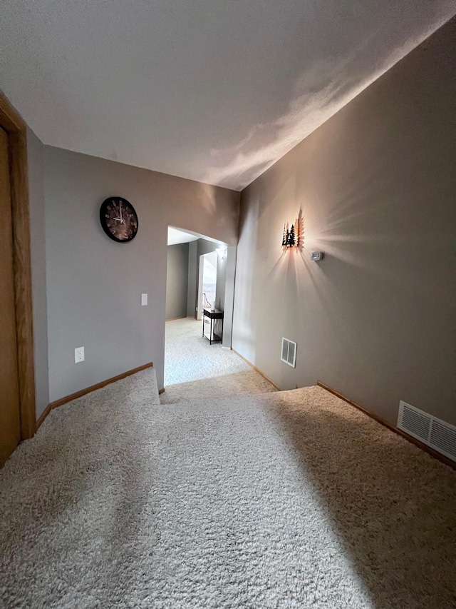 unfurnished room with carpet floors