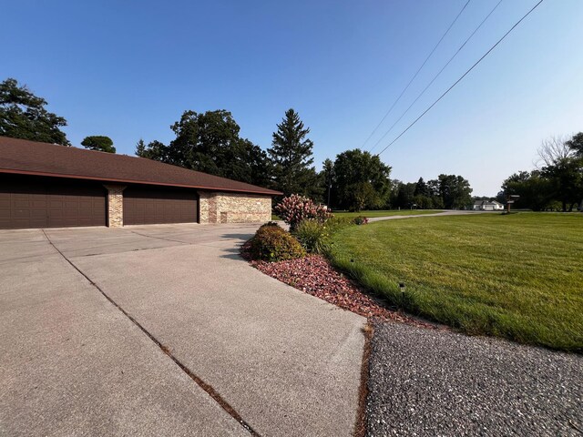 view of side of home featuring a lawn