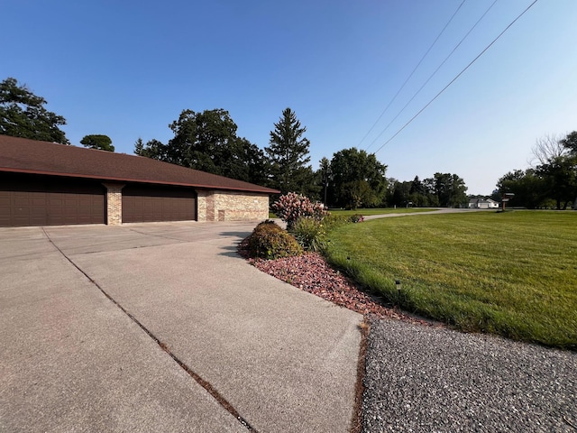 view of side of home with a yard