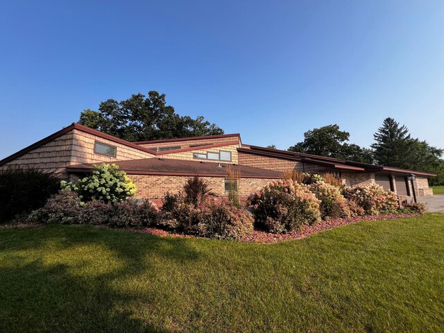 view of home's exterior featuring a yard