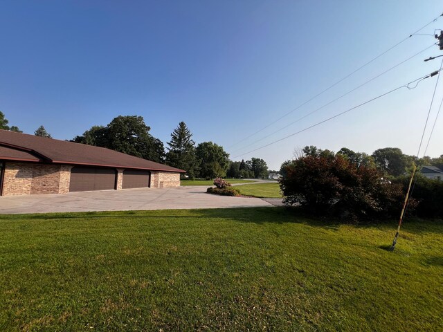 view of yard featuring a garage