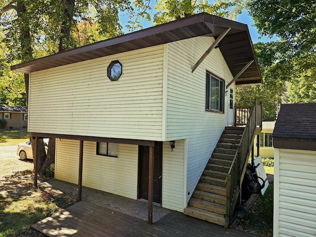 exterior space with a deck and stairs