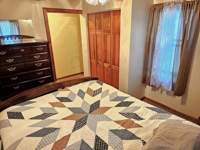 bedroom with a closet and baseboards