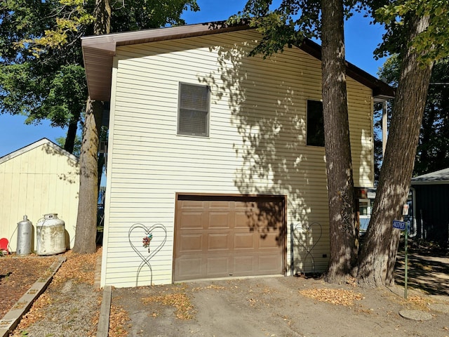 view of side of home with an attached garage