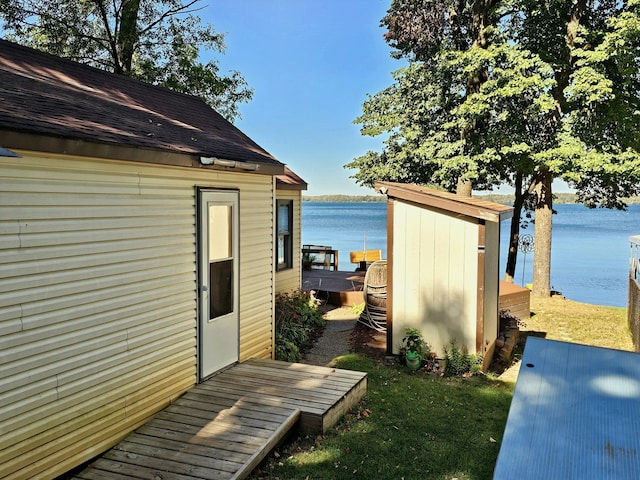 view of outbuilding featuring a water view