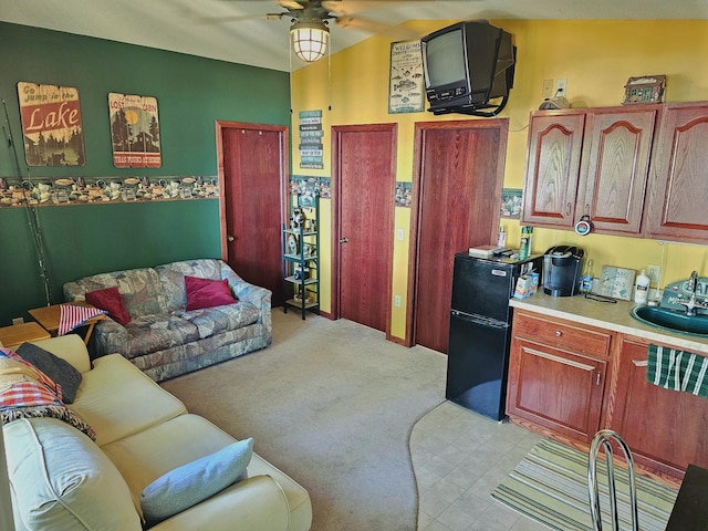 living room featuring light carpet and a ceiling fan