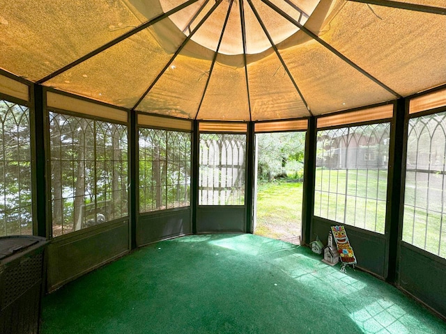 unfurnished sunroom featuring a wealth of natural light