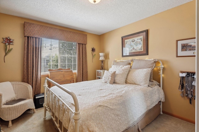 carpeted bedroom featuring a textured ceiling