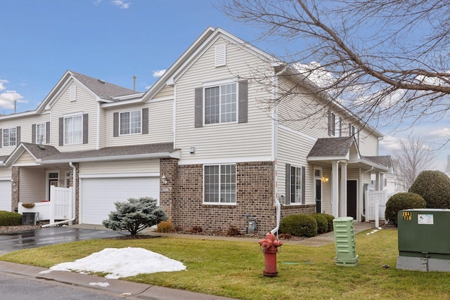 view of front of property with a garage and a front yard