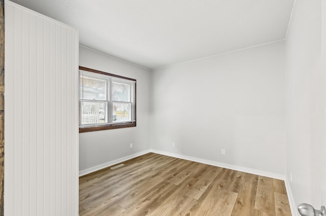 unfurnished room with light hardwood / wood-style floors