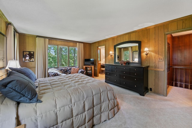 carpeted bedroom featuring ornamental molding and wooden walls