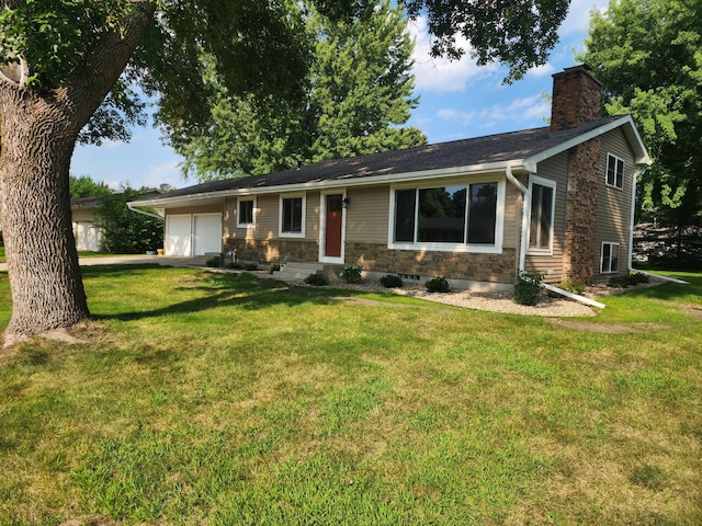 ranch-style home with a garage, a front lawn, and a chimney