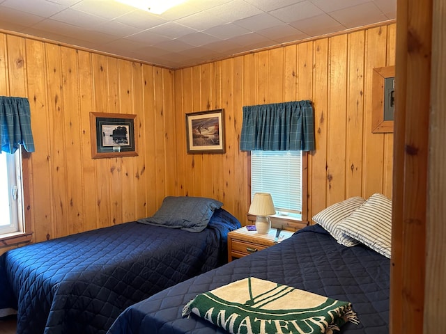 bedroom with wood walls