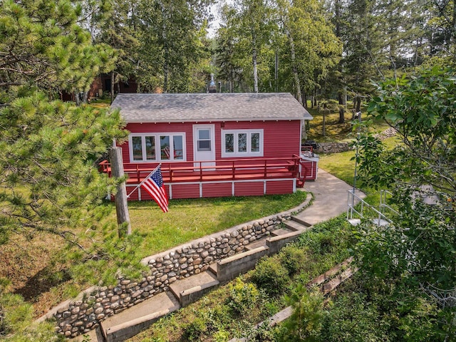 view of outbuilding with a yard