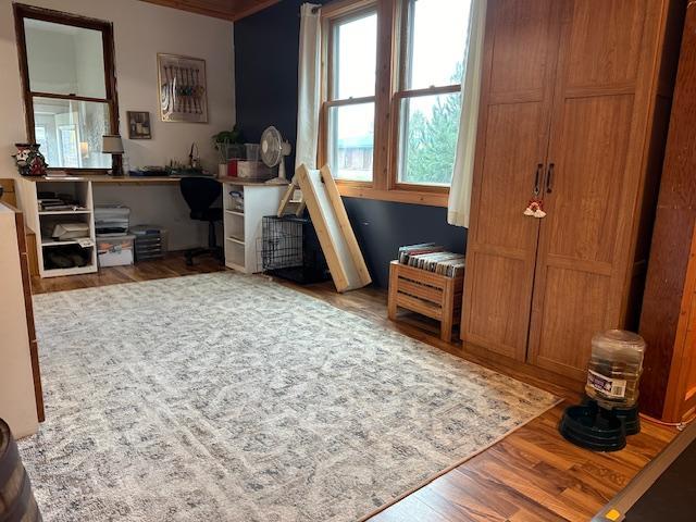 interior space featuring crown molding and wood-type flooring