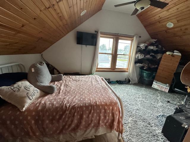 bedroom with wood ceiling, ceiling fan, and vaulted ceiling