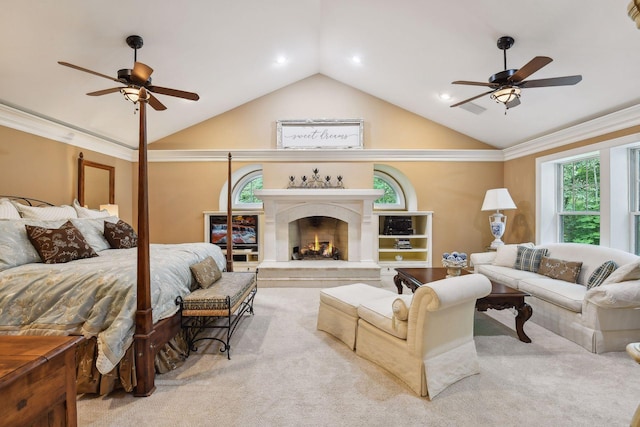 carpeted bedroom with ceiling fan, lofted ceiling, and ornamental molding