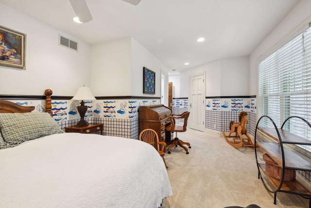 bedroom featuring ceiling fan and light colored carpet