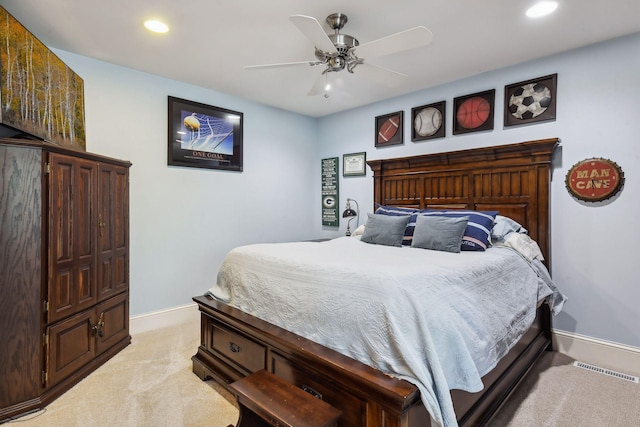 bedroom with ceiling fan and light colored carpet