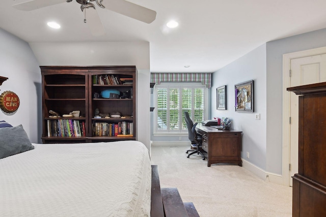 bedroom with ceiling fan and light carpet