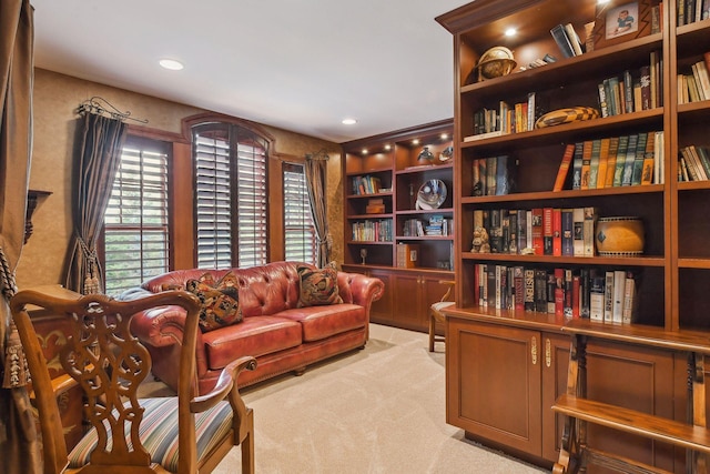 living area featuring light colored carpet