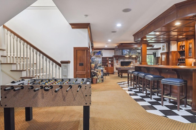 game room with ornamental molding and light carpet