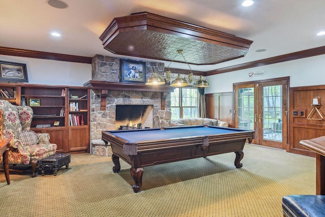 playroom featuring carpet, french doors, pool table, and a stone fireplace