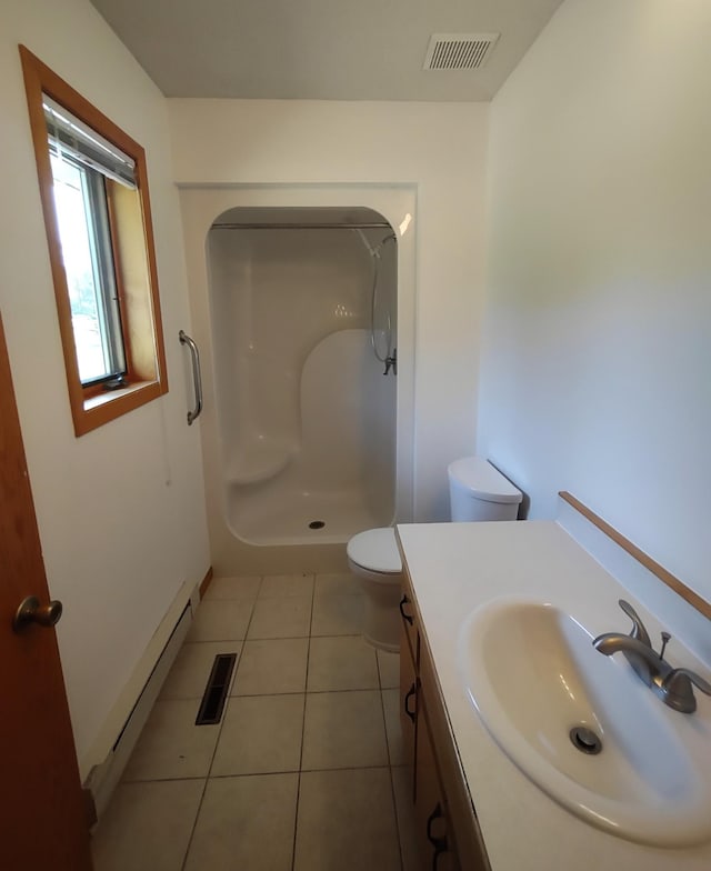 bathroom with toilet, tile patterned floors, walk in shower, baseboard heating, and vanity