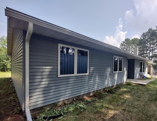 view of home's exterior featuring a lawn