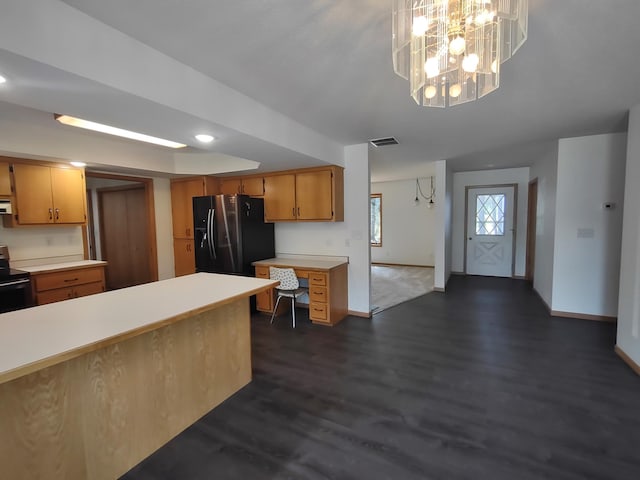 kitchen with black range with electric stovetop, dark hardwood / wood-style flooring, an inviting chandelier, and stainless steel refrigerator with ice dispenser