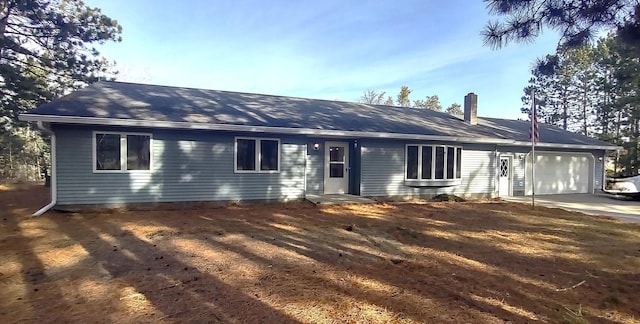 ranch-style house featuring a garage